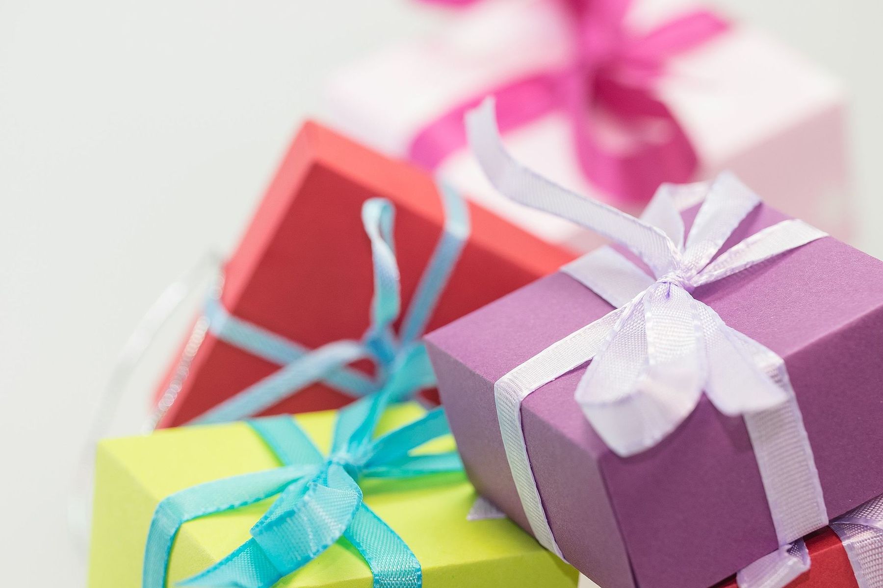 Pastel gift boxes tied with lilac and aqua ribbons